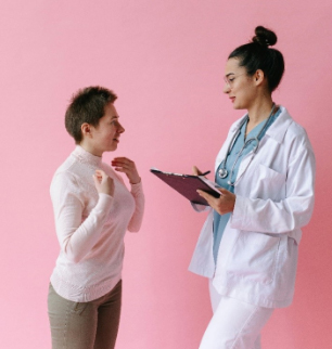 A female patient talks to a female medical professional